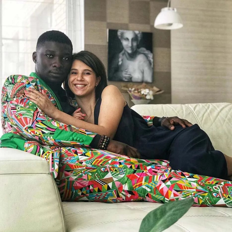 A reunited couple resting together at home